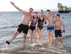 Colin Campbell, Tina Ryan, Helen Sullivan, Miquel Sullivan and Daire Ryan, all from Salthill, after finishing their Christmas Day swim at Blackrock.