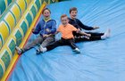 <br />
Boys coming down the slide at the Corofin Festival. 