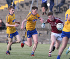 Galway v Roscommon Minor Football Championship game at Tuam Stadium.<br />
Conor Raftery, Galway, and Enda Crawley and Jack Lohan, Roscommon