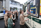 Tomás Mac an Ghoill, Rang 5, receiving an ice cream cone during a break at Scoil Fhursa which reopened on Monday.