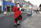 Galway Town Crier Liam Silke out on the city centre streets on Monday welcoming back shoppers and thanking staff and business owners, who have been able to reopen, after the easing of Covid-19 restrictions.