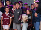 Galway Manager Pádraic Joyce's daughter Jodie holding her pet dog during the homecoming ceremony at Pearse Stadium on Monday evening.