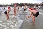 Some of the swimmers were out in force at Blackrock in Galway on Christmas Day. Many took the plunge in aid of local charities. Photograph: Joe O'Shaughnessy. 25/12/2018