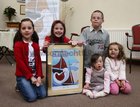 Emily Brosnan, Hannah and Francis Carr, and Cariosa and Sarah Williams, all from Bearna, at the Cillin at Bearna Church for the launch of 'The Journey', prints of the late Chris Montague's painting in aid of children with Down's Syndrome in Galway.