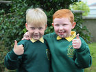 Friends Adam Power, Knocknacarra, left, and Thomas McDonagh from Barna give the thumbs up after attending their first day at Scoil Ide, Árd Na Mara, Salthill.