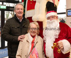Santa (Fred Diviney) with Adrian and Mary Neary after he welcomed them to the Mervue and Renmore Community Christmas lunch in the Connacht Hotel.