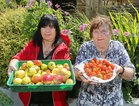 Volunteers Bridie Canavan and Deirdre Dooley display some of the produce at the Ballybane Community Garden Open Day.