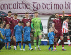 The Galway United team and young mascots walk on the the pitch before the SSE Airtricity League Premier Division game against Derry City last Friday evening.