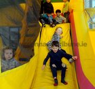 <br />
Coming down the slide at  the Knocknacarra Educate Together Spring Fair  held at the school. 