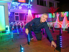 James Carrick putting the finishing touches to his Christmas lights